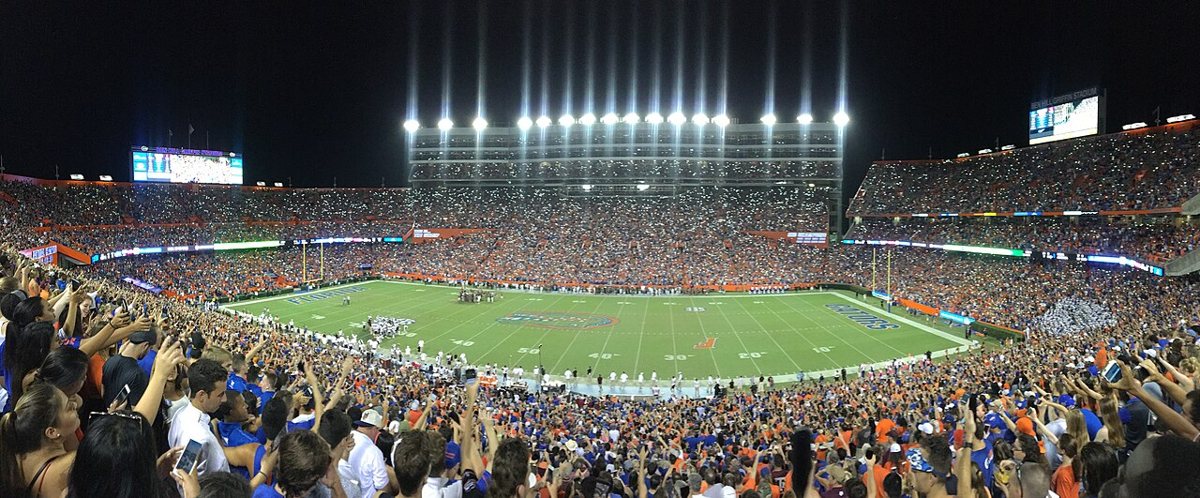 Ben Hill Griffin Stadium in Gainesville packed at night with phone lights raised