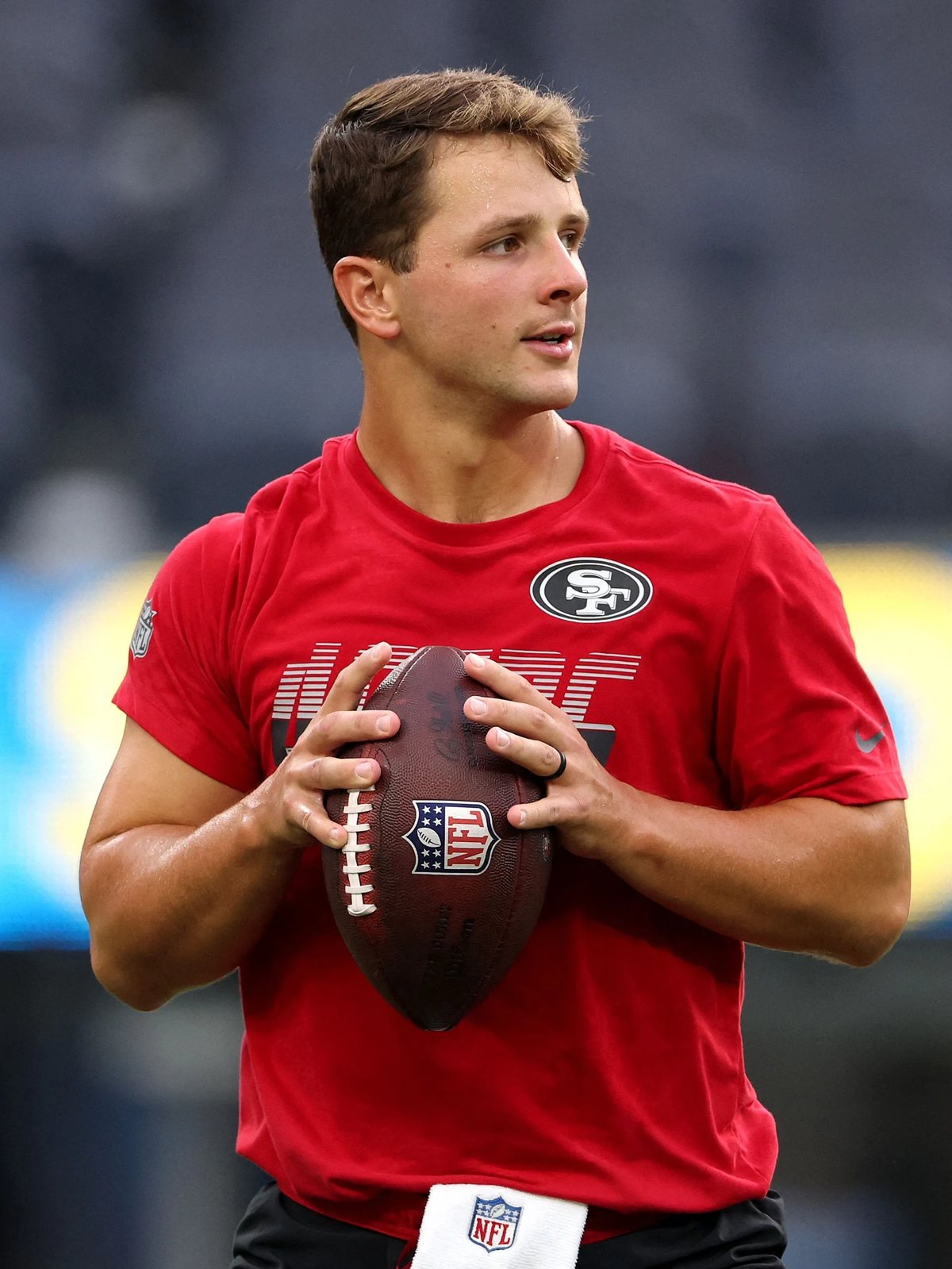 Brock Purdy holding a football during 49ers warmups before a 2026 preseason game
