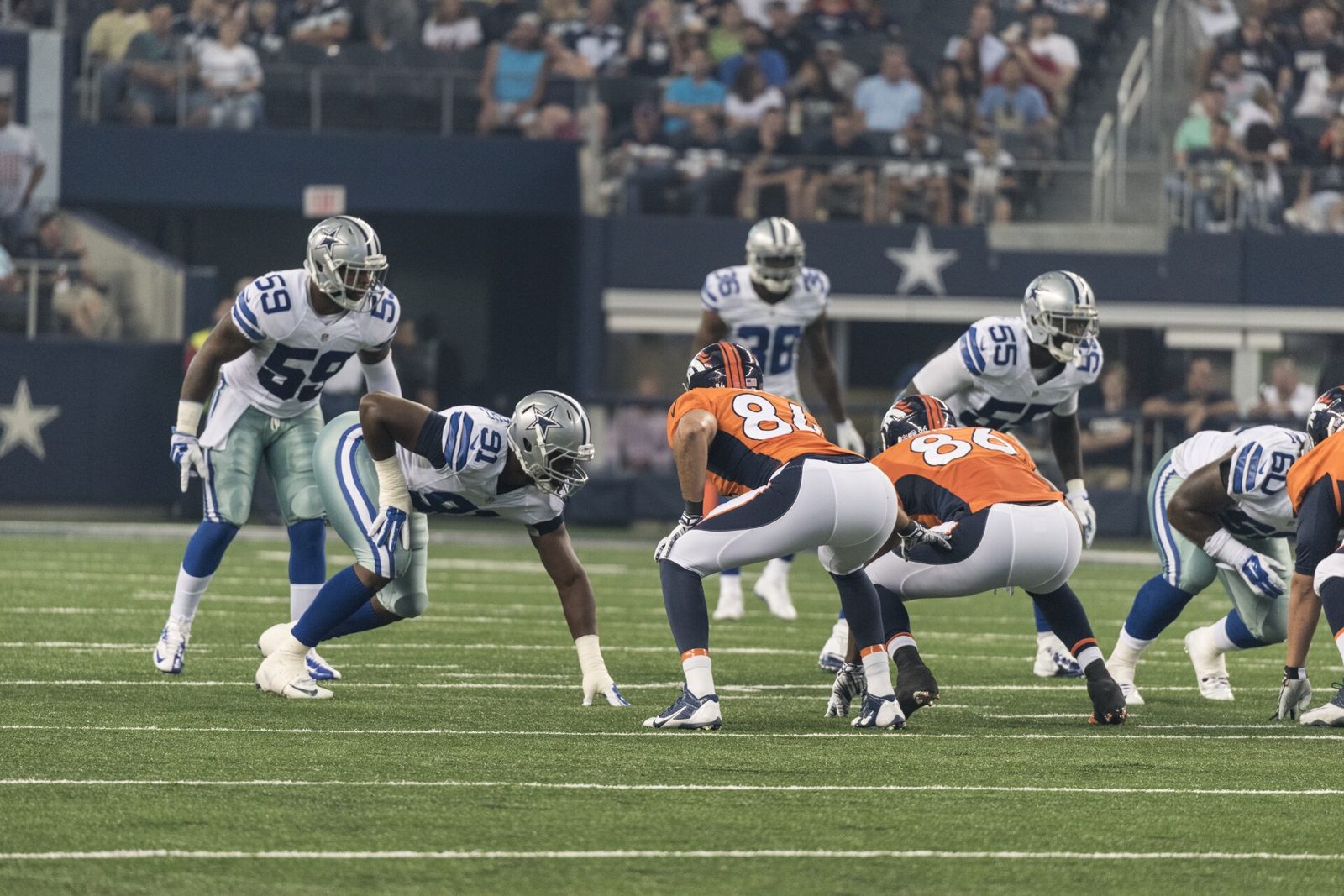 The Dallas Cowboys defense lines up at the line of scrimmage on the field at AT&T Stadium in Arlington, where the Buccaneers visit on Thursday Night Football