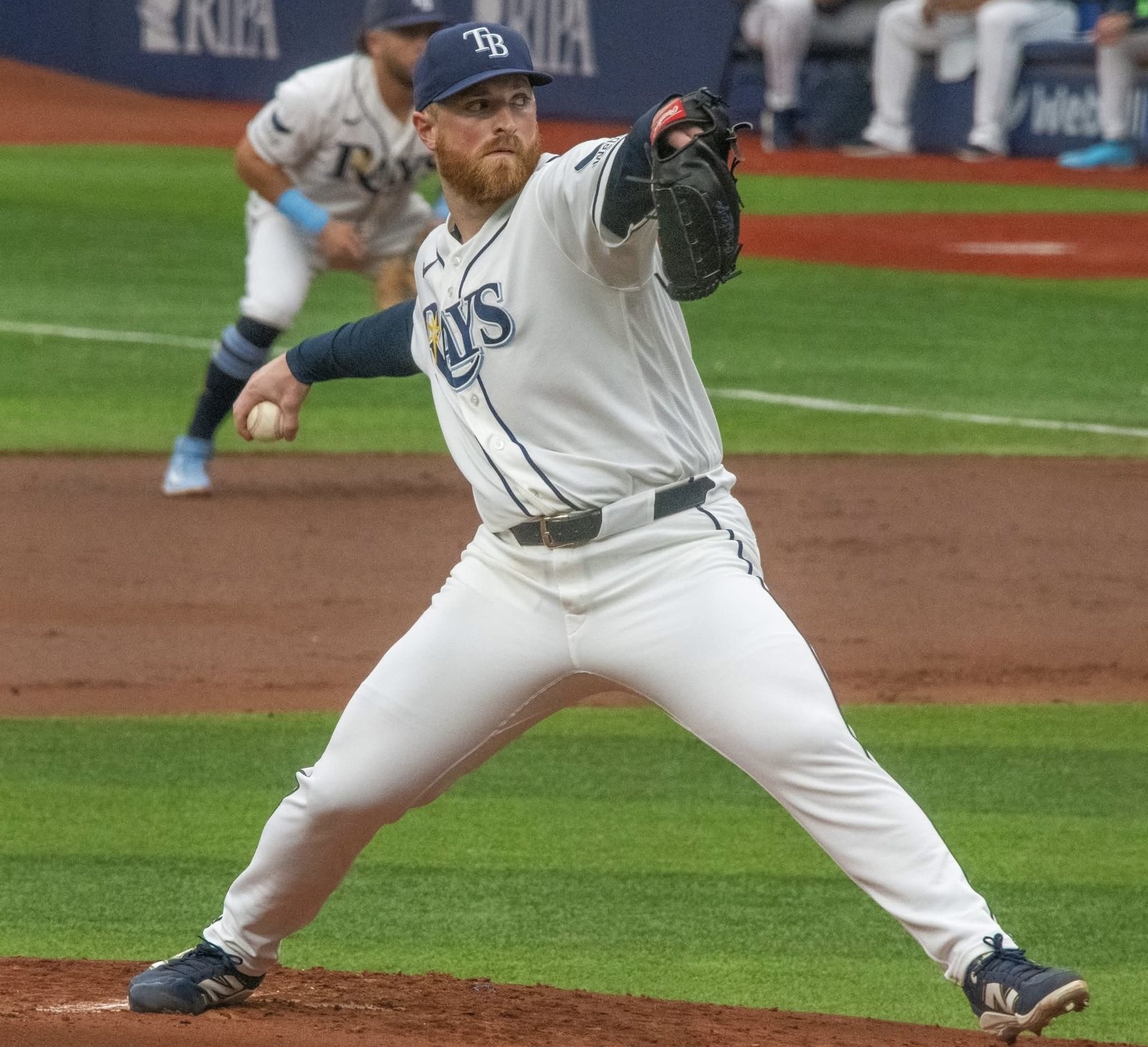 Tampa Bay Rays starter Drew Rasmussen, in the white Rays home uniform, driving toward the plate during a June 2026 game, the right hander who starts ALDS Game 1 against the Yankees