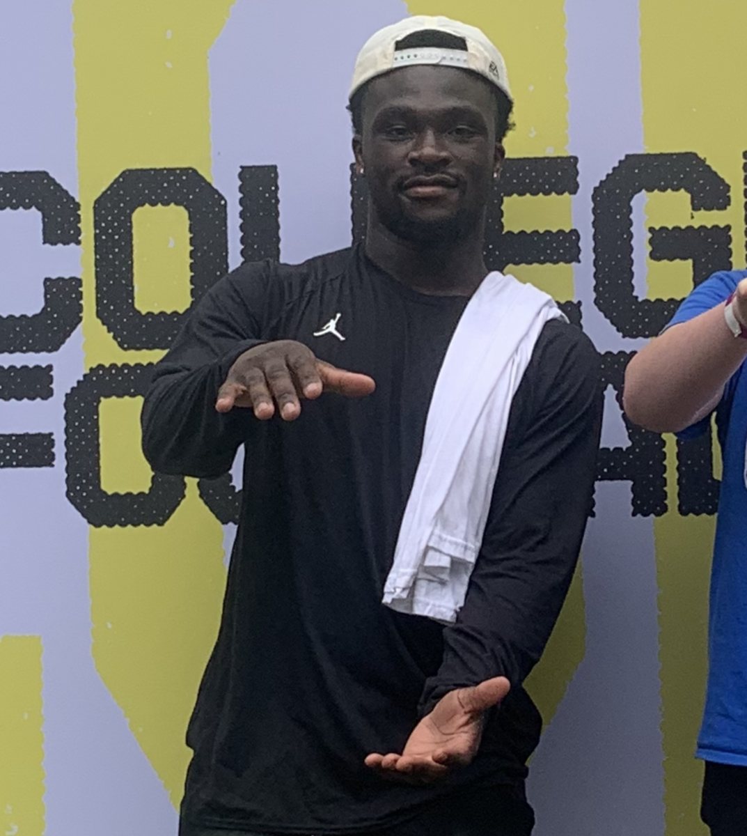 Florida running back Jadan Baugh doing the Gator Chomp at a promotional event