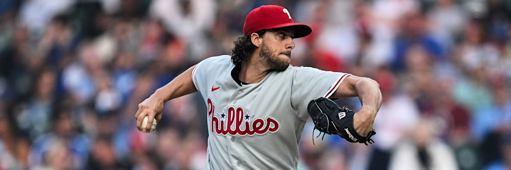 Aaron Nola Philadelphia Phillies right-handed starting pitcher delivering on the road in his away grays