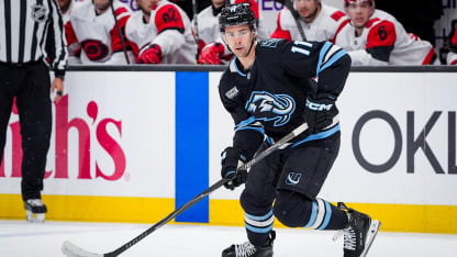 Utah Mammoth forward skates up ice in home jerseys at Delta Center during the 2026 NHL season